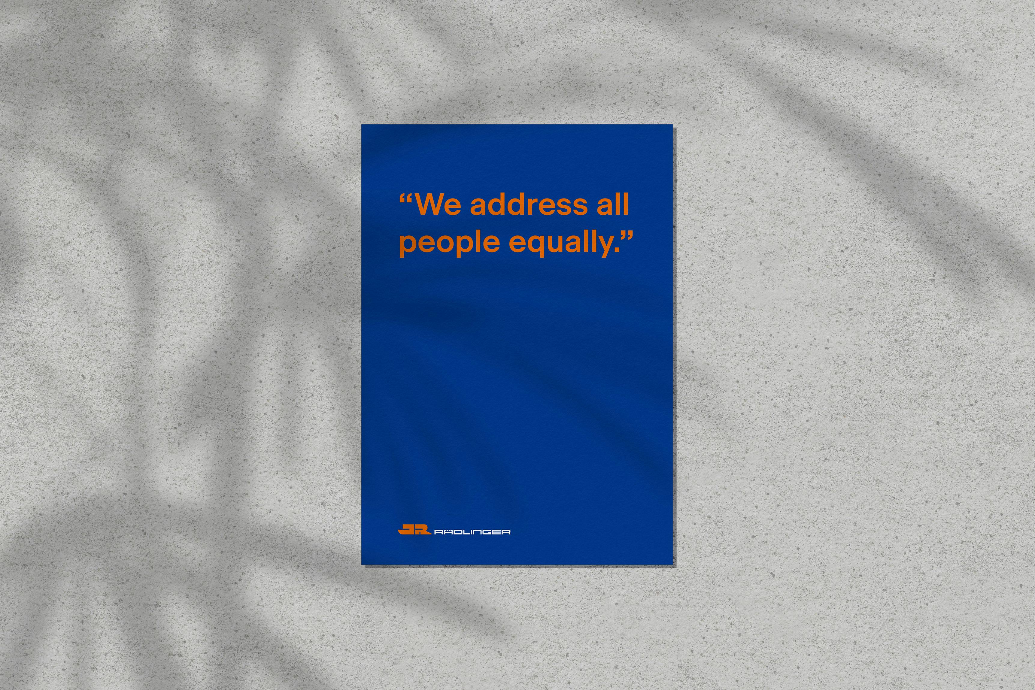 Blue sheet of paper on which is written in orange lettering, "We address all people equally."